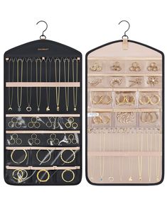 two black and white racks with gold jewelry on them, one is hanging from the wall