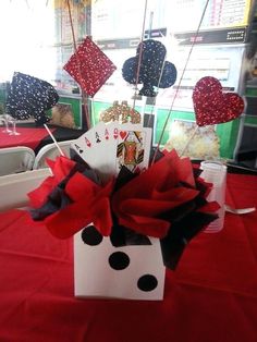 a card table with red, white and black decorations