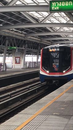 a subway train pulling into the station platform