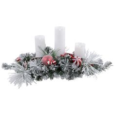 an arrangement of christmas decorations and candles on a white background with snowflakes, pine cones and candy canes