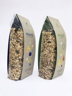 two bags of muesli sitting next to each other