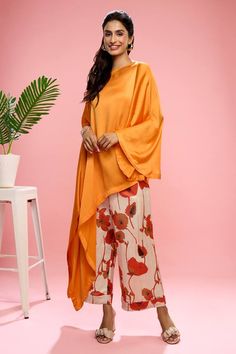 Orange draped top in satin georgette base. Comes with floral printed pant. - Aza Fashions Orange Drapes, Orange Satin, Floral Print Pants, Draped Top, Top And Pants Set, Pant Set, Top Pattern, Set For Women, Flared Sleeves