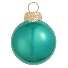 a green ornament hanging from a gold chain on a white background with clippings