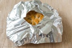 a piece of food that is sitting on some tin foil