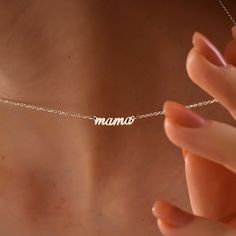 Celebrate mom with our precious Sterling Silver Mama Necklace. This dainty necklace features the word "Mama" in a beautiful script font, crafted from high-quality sterling silver. It's a timeless and elegant way for her to show off her mama pride, perfect for everyday wear or dressing up for a special occasion. Super Features * Mama Love in Silver: The sparkling sterling silver adds a touch of sophistication to this meaningful necklace. * Delicate & Everyday-Ready: The dainty design makes this n Meaningful Necklace, Beautiful Script Fonts, Mama Necklace, Celebrate Mom, Mom Necklace, Necklace Dainty, Perfect Gift For Mom, Letter Necklace, Love Symbols