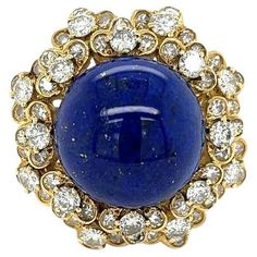 Simply Beautiful! Elegant and finely detailed Lapis Lazuli and Diamond Vintage Cluster Ring. Centering a Securely Hand set Cabochon Blue Lapis Lazuli, surrounded by Diamonds weighing approx. 3.00 total Carat weight. Hand crafted in 18 Karat yellow Gold. Ring size 7.25, we offer ring re-sizing. In excellent condition, recently professionally cleaned and polished. More Beautiful in real time! Sure to be admired…Timeless and outstanding in every way! Vintage Cluster Ring, Gold Cocktail Ring, Blue Lapis Lazuli, Gold Cocktail, Blue Lapis, Diamond Gold, Heel Boots, Vintage Diamond, Cluster Ring