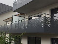 an apartment building with balcony and balconies