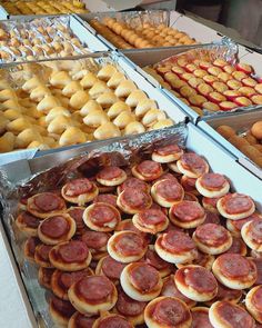 many different types of pastries are on display