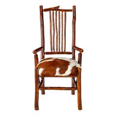 a brown and white cowhide chair on a white background