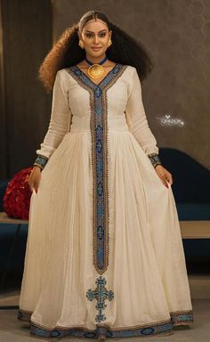 The Habesha dress is made in a modern way, which is chosen for special events and is a simple Habesa and Eritrean dress.#Ethiopia habesha women #holiday dress#Ethiopia wedding #ethiopia gold jewelry.