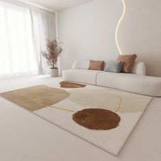 a living room with a white couch and large rugs on the floor in front of a window