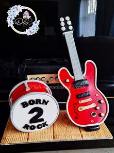 two cakes made to look like guitars and drums