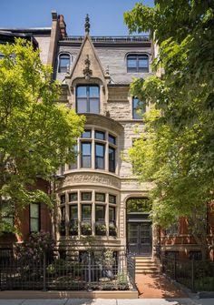 a large house with many windows in the front