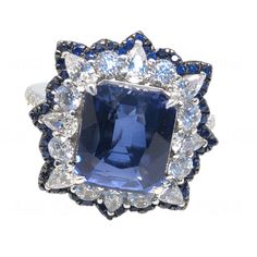 an image of a blue and white ring with diamonds on the bottom, surrounded by other jewels