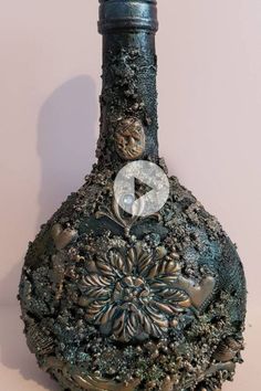 an ornate vase is sitting on the floor in front of a white wall and pink background