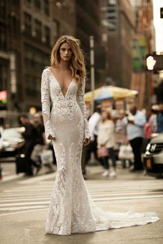 a woman in a wedding dress on the street