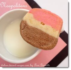 there is a cup of milk and a cookie in the shape of an ice cream sandwich