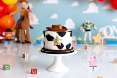 a toy story themed birthday cake on a table