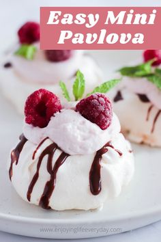 easy mini pavoa desserts with raspberries and chocolate drizzled on top