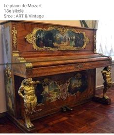 an old piano is sitting on the floor