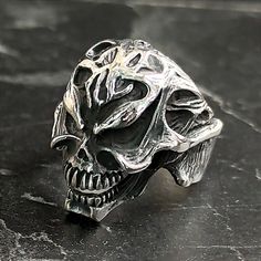 Men Skull Gothic Engraved Silver Ring , Motorcycle Punk Hippie Ring , Skull Metalsmith Hipster Ring, Cool Ring , Gothic Ring Jewelry for Men , Gift For Him , Same Day For Shipping ✧ Product Details * Handmade İtem * Gender : Male / Female * Material : 925K Sterling Silver * Ring Weight : 13.5 Grams ✔ Usage Details * Silver jewelry is very sensitive to chemicals. It is recommended to keep away from chemical substances such as cream, bleach, deodorant, detergent. * Silver jewelry can also darken quickly in salt water, that is, in sea water. For this reason, it is best to remove them when swimming in the sea. ✔ Shipping * Your orders placed on weekdays are delivered to the cargo on the same day. Your orders placed on the weekend are delivered to the cargo on Monday. ✔ Other Details * Our prod Black Ring For Halloween Streetwear, Silver Grunge Rings For Halloween, Punk Skull Ring For Halloween Streetwear, Black Skull Ring For Halloween Streetwear, Punk Style Skull Ring For Halloween Collectible, Black Symbolic Skull Ring For Halloween, Symbolic Black Skull Ring For Halloween, Black Punk Skull Ring Collectible, Black Punk Style Skull Ring Collectible