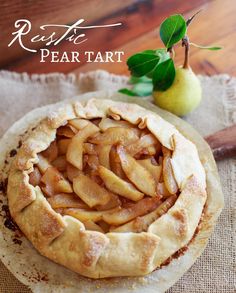 an apple pie on top of a wooden table