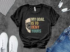 a t - shirt that says,'my goal is to demy yours '