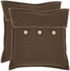 two brown pillows with buttons on them