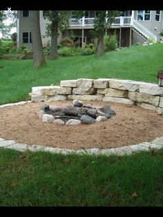 a fire pit in the middle of a yard