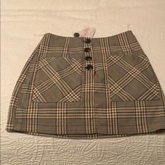 Plaid Skirt With Button Detail On Front. Purchased From Pink Lily Boutique. Never Worn. Fall Mini Skort With Button Closure, Mini Skirt With Buttons For Day Out, Mini Skirt With Button Closure For Day Out, Day Out Mini Skirt With Buttons, Fall Skirt Skort With Button Closure, Fall Skort With Button Closure, Fitted Button-up Mini Skirt With Lining, Retro Fitted Mini Skirt With Button Closure, Fitted Button-up Lined Mini Skirt