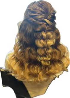 the back of a woman's head with long curly hair