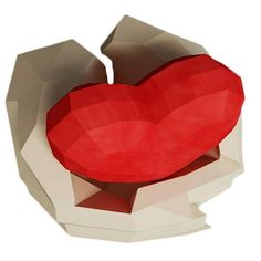 a red heart shaped box sitting on top of a piece of white paper in the shape of an origami