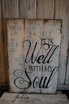 a wooden sign that says it's well with my soul