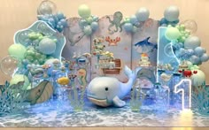 an ocean themed birthday party with balloons and decorations