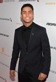 a man in a tuxedo and bow tie at an american airlines gala event