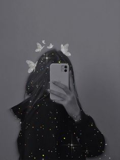 a girl with butterflies on her head holding a cell phone in front of her face