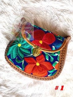 Gorgeous Leather cross body bag Multi-Color embroidery  Adjustable leather strap Available in 2 styles!  Dimensions (L x W x H): Multicolor Embroidered Crossbody Shoulder Bag With Adjustable Strap, Multicolor Embroidery Crossbody Shoulder Bag, Multicolor Embroidered Shoulder Bag With Adjustable Strap, Leather Shoulder Bag With Floral Embroidery For Daily Use, Leather Shoulder Bag With Floral Embroidery For Travel, Multicolor Embroidered Shoulder Bag With Adjustable Strap For Everyday, Multicolor Embroidered Crossbody Bag, Brown Embroidered Crossbody Shoulder Bag, Embroidered Brown Crossbody Shoulder Bag