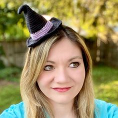 a woman wearing a crocheted witches hat