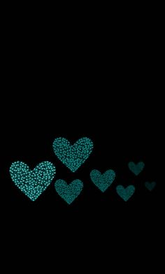 some blue hearts on a black background