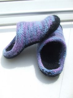 a pair of slippers sitting on top of a window sill next to a door