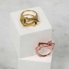 This ring has a contemporary aesthetic with a minimalist look and feel. The handmade ring is set in Rose gold Vermeil on Sterling Silver and features a narrow bar with two gemstones. The Rainbow Moonstone and Rose Quartz gemstones have a baguette cut and are placed alongside each other. The ring can be worn individually or mixed and matched with one of our other geometric stacking rings.This original designer piece has been handmade and ethically produced by our artisan craftsmen using only the Modern Stackable Rings With Tension Setting, Modern Gemstone Stackable Rings For Formal Events, Modern Gemstone Stackable Rings For Formal Occasions, Modern Stackable Gemstone Rings For Formal Events, Modern Open Band Promise Ring, Modern Gold Stackable Rings With Tension Setting, Modern Rose Gold Jewelry With Tension Setting, Modern Yellow Gold Diamond Ring With Gemstone, Modern Yellow Gold Diamond Ring