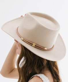 Everything you need in a hat band - adjustable, removable + confidence-boosting. A minimalist vegan leather hat wrap band featuring gold detailing to naturally elevate any look. Elegant Gold Adjustable Felt Hat, Elegant Adjustable Gold Felt Hat, Adjustable Gold Wide Brim Fedora, Adjustable Brimmed Gold Fedora, Adjustable Gold Brimmed Fedora, Adjustable Chic Hats For Everyday, Adjustable Western Felt Hat For Everyday, Chic Adjustable Hats For Everyday Wear, Elegant Adjustable Gold Fedora