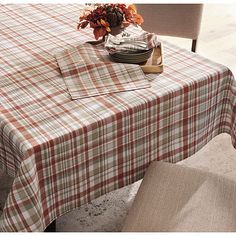 a plaid table cloth on a dining room table