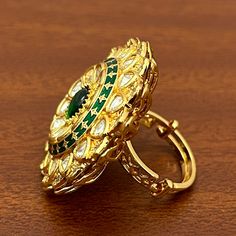 About: Classy and detailed designer gold plated kundan beaded ring. This is stylish and adjustable. This ring will work well with traditional, formal, and western formals. Details: Eye-catching and unique jewelry that will set you apart. Gift this piece to a loved one, and see their face light up with joy. Best for gifting or for personal use, wear it to any occasion and become the spotlight. Festive Gold Kundan Ring, Gold Kundan Toe Ring, Kundan Toe Rings For Festivals, Gold Kundan Rings In Temple Jewelry Style, Traditional Adjustable Rings For Festive Occasions, Festive Kundan Ring Jewelry, Festive Kundan Rings With Stone Setting, Festive Kundan Rings With Stone Work, Kundan Rings As Festive Gifts