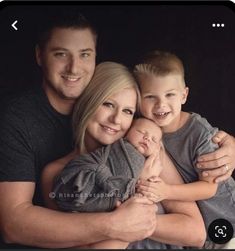 a man, woman and child are smiling for the camera with their arms around each other