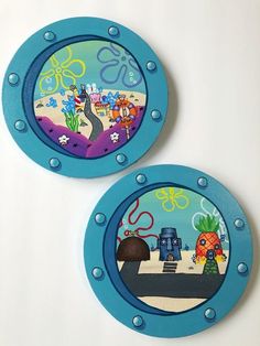 two blue plates with cartoon images on them