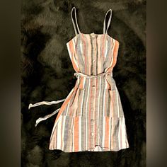 Spaghetti Strap, Grey, Orange, And Pink Stripped Sundress. Has A Fabric Tie Belt And Buttons Up The Front. Not New, But Never Worn. Casual Multicolor Sundress With Adjustable Straps, Casual Pink Dresses With Adjustable Straps, Summer Striped Mini Dress With Spaghetti Straps, Striped Beach Dresses With Tie Straps, Striped Spring Dress With Tie Straps, Casual Pink Mini Dress With Adjustable Straps, Striped Dresses With Tie Straps For Spring, Striped Dress With Tie Straps For Spring, Summer Striped Cotton Mini Dress