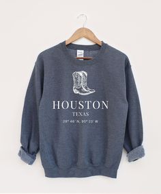 Houston Sweatshirt, Texas Sweater, USA State Hoodie, Houston Texans ♥ PRODUCTION TIME: 1-5 days (Usually 1-2 days) ♥ SHIPPING TIME: 2-5 days (Usually 3 days) ♥ PRODUCT DESCRIPTION: Ideal for any situation, a unisex heavy blend crewneck sweatshirt is pure comfort. These garments are made from polyester and cotton. This combination helps designs come out looking fresh and beautiful. The collar is ribbed knit, so it retains its shape even after washing. There are no itchy side seams on these sweate Gray Fitted Cotton Sweatshirt, Fitted Cotton Winter Sweatshirt, Fitted Crew Neck Graphic Print Hoodie, Fitted Graphic Print Hoodie With Crew Neck, Fitted Letter Print Hoodie For Fall, Fitted Fall Sweater With Letter Print, Unisex Long Sleeve Sweatshirt For Fall, Casual Fitted Letter Print Sweatshirt, Fitted Crew Neck Hoodie For Winter