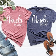 Abuelo Shirt, Abuela Shirt, EST Pregnancy Announcement, Custom Granparents Shirts, Nana to Be Shirt, Papa to Be Shirt, Baby Reveal Shirt. HI! Welcome to my store, I'm delighted to see you here. My store's main goal is to provide you with premium everyday apparel with the best graphic t-shirts. I see you as a friend, not just a customer. I'm sure you'll love my designs. You can order the same design 4XL and 5XL large sizes from the link, please specify the details in the order note.   https://ets Grandma To Be Shirts, Cotton Tops With Name Print For Family Reunion, Casual Pink Shirt For Family Occasions, Casual Pink Tops For Family, Security Shirt, Baby Reveal Shirt, Aunt Shirts, Brother Shirts, Pregnancy Announcement Shirt