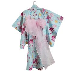 Girls yukata in light blue with Temari Japanese balls and cherry blossoms. Yukata is an unlined cotton summer kimono, worn in casual settings such as summer festivals. It is made with lightweight cotton or linen, perfect for warm weather. This easy-to-wear ohashori yukata comes ready to wear. This means it is already tucked at the waist and sewn in. The shoulders are also tucked and sewn. The threads can be easily taken out to add length and width as your child grows. This yukata comes with a soft obi sash that can be easily wrapped around the waist and tied with a bow at the back. Yukata is traditionally worn with wood geta sandals. You can find Kids Geta sandals (size between 16cm-21cm ) here. For sizes above US 6, you can find Geta sandals here. Size info: 100cm Yukata length and size m Geta Sandals, Men's Yukata, Obi Sash, Summer Festivals, Traditional Kimono, Summer Kimono, Satin Kimono, Womens Kimono, Embroidered Hats